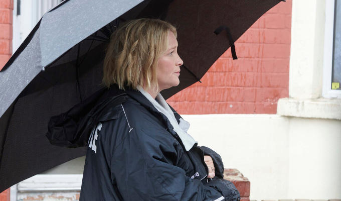 Jo Page on set with an umbrella